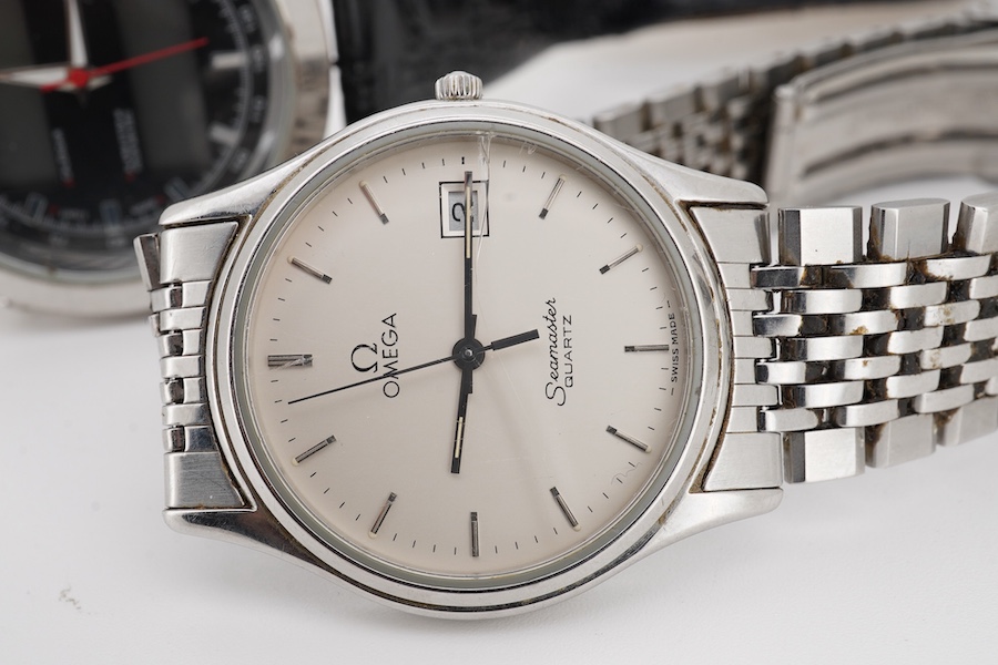 A gentleman's 1980's stainless steel Omega Seamaster quartz wrist watch, with baton numerals and date aperture, case diameter 33mm, (glass cracked), on a stainless steel Omega bracelet, no box or papers, together with on
